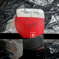 Henry Cooper and Barry McGuigan signed red 10oz boxing glove. Good condition. All autographs come