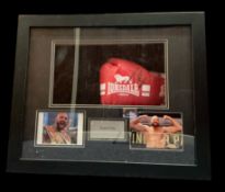 Tyson Fury signed red Lonsdale boxing glove in 24x20x5 inch box display. Good condition. All