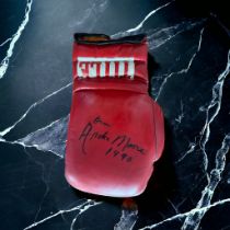 Archie Moore signed red Title vintage boxing glove. Archie Moore (born Archibald Lee Wright;