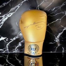 Evander Holyfield signed gold VIP boxing glove. Evander Holyfield (born October 19, 1962) is an