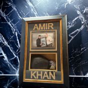 Amir Khan signed black Lonsdale boxing glove in 28x19x6inch box display. Good condition. All