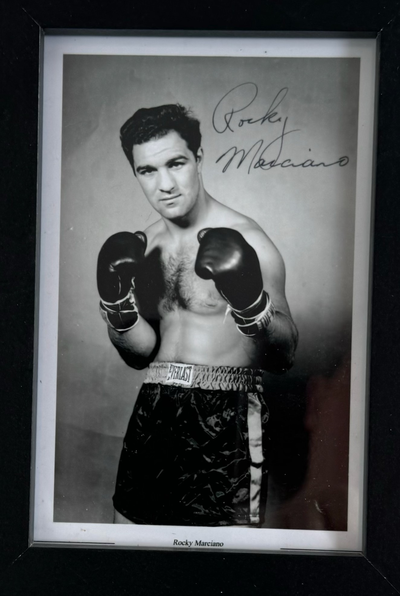 Rocky Marciano signed 6x4inch black and white photo. Framed. Good condition. All autographs come