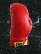 Michael Spinks and Leon Spinks signed red Everlast boxing glove. Michael Spinks (born July 13,