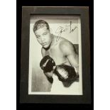 Joe Louis signed vintage photo. Framed to approx 6x4inch. Good condition. All autographs come with a