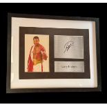Larry Holmes signature piece. Mounted and framed with colour photo and name plaque. Approx overall