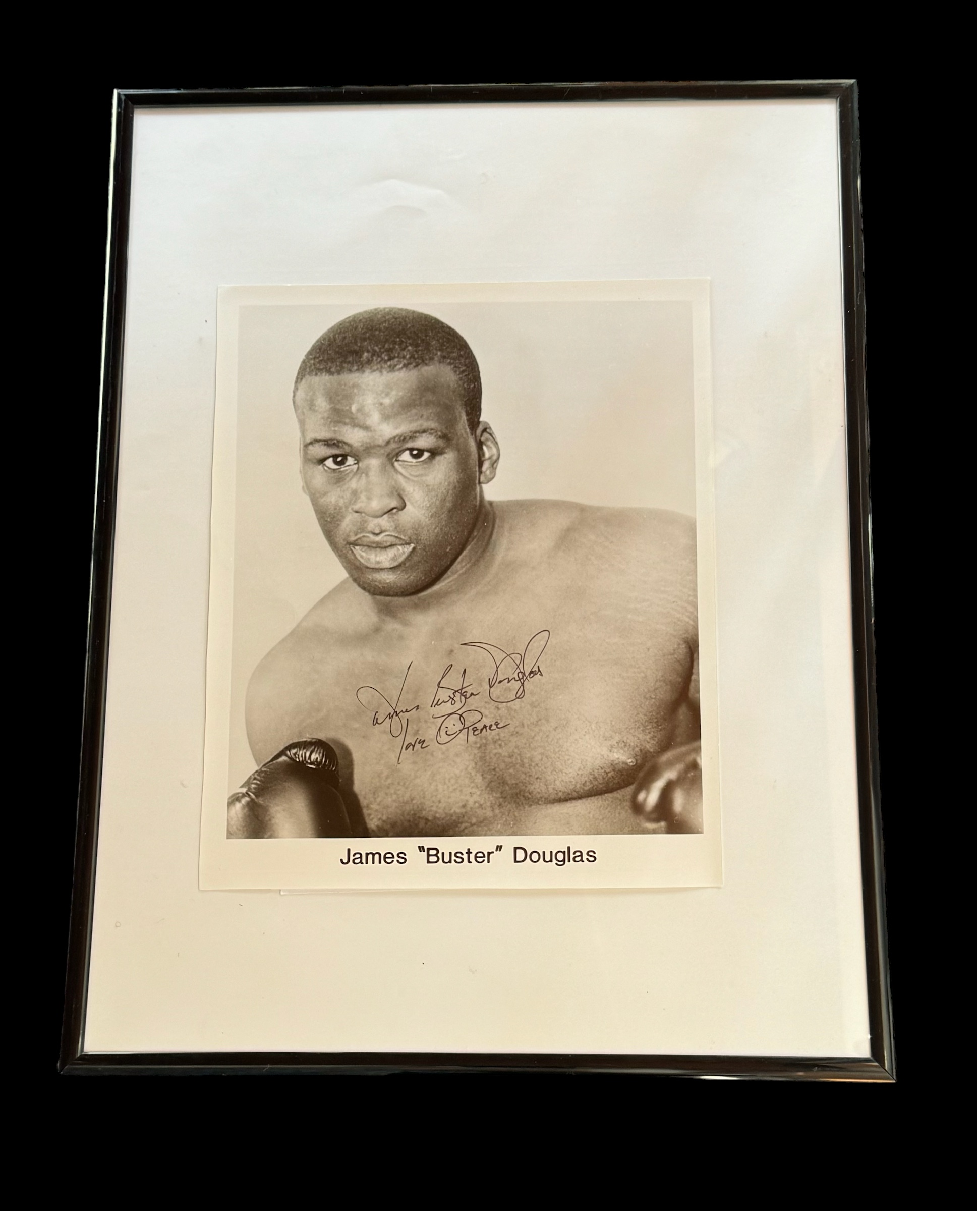James Buster Douglas signed 16x12 inch overall framed and mounted black and white photo. Good