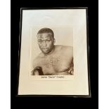 James Buster Douglas signed 16x12 inch overall framed and mounted black and white photo. Good