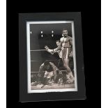 Joe Frazier and George Foreman signed black and white photo. Framed to approx 6x4inch. Good