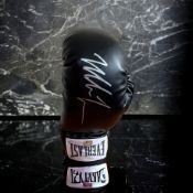 Mike Tyson signed black Everlast boxing glove. Good condition. All autographs come with a