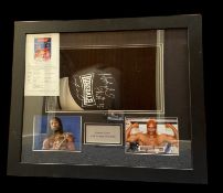 Lennox Lewis and Evander Holyfield signed black Lonsdale boxing glove in 24x20x5 inch box display.