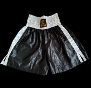 Mike Tyson signed black boxing shorts. Good condition. All autographs come with a Certificate of