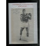 Buster Mathis signed black and white newspaper photo. Framed to approx size 12x10inch. Good