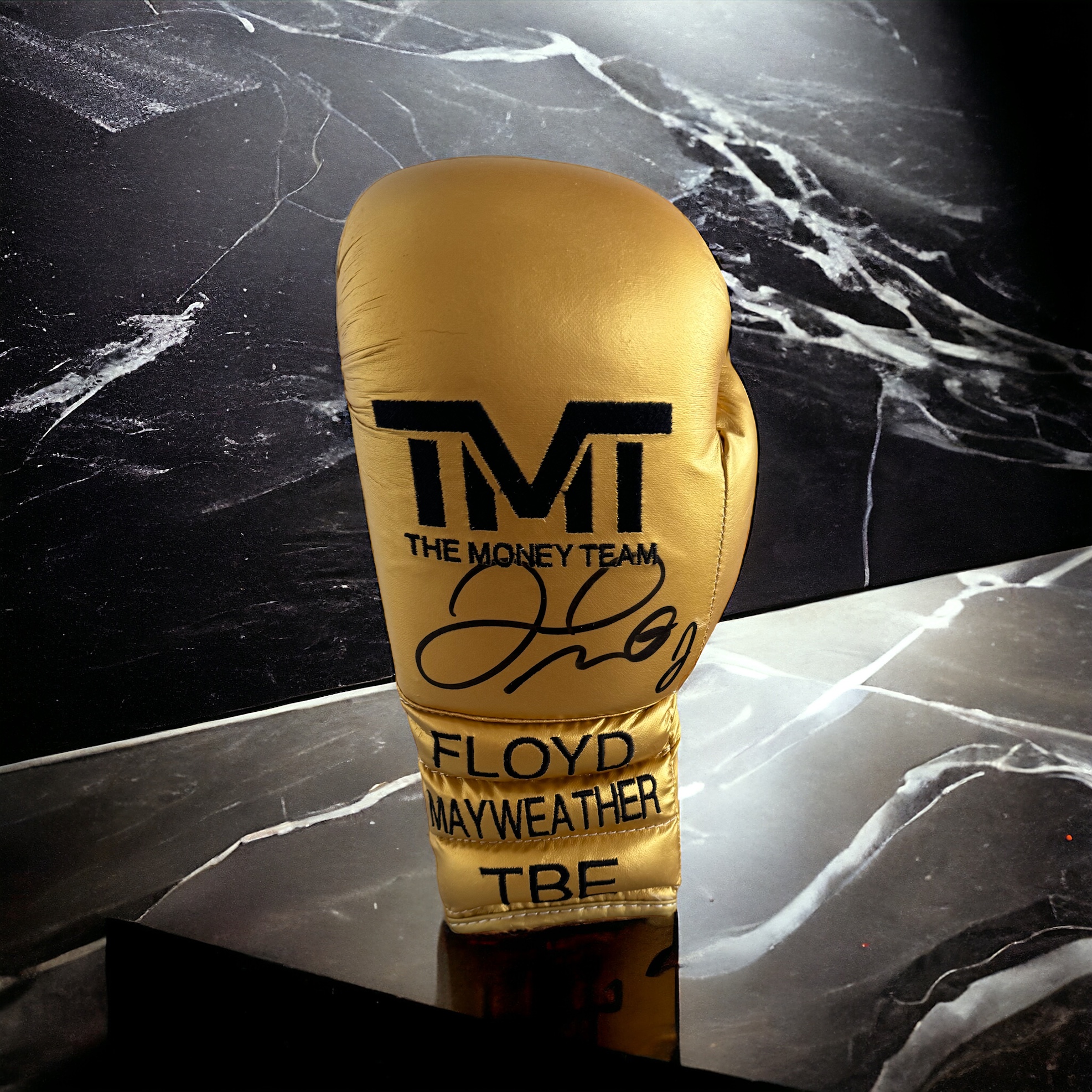 Floyd Mayweather signed gold The Money team boxing glove. Floyd Joy Mayweather Jr. (né Sinclair;