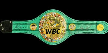 Larry Holmes and 1 other signed WBC mini belt. Good condition. All autographs come with a