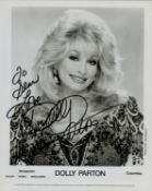 Dolly Parton signed 10x8 inch black and white promo photo dedicated. Good condition. All