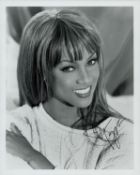 Tyra Banks signed 10x8 inch black and white photo. Good condition. All autographs come with a