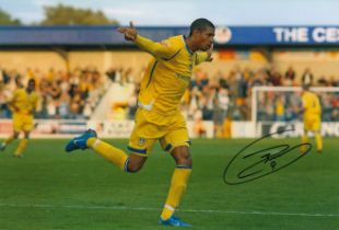 Autographed JERMAINE BECKFORD 12 x 8 Photo : Col, depicting Leeds United's JERMAINE BECKFORD running