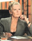 Judi Dench signed colour photo from her role as M in James Bond. Measures 8"x10" appx. Good