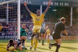Autographed CHRIS WHYTE 12 x 8 Photo : Col, depicting CHRIS WHYTE celebrating after scoring Leeds