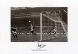 Peter Shilton signed 16 x 12 black and white print. Print shows Shilton making the save of the