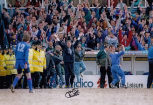 Autographed JOE ROYLE 12 x 8 Photo : Col, depicting Oldham manager JOE ROYLE celebrating on the