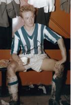 Autographed DENIS LAW 12 x 8 Photo : Col, depicting a muddied DENIS LAW, cup of tea in hand,