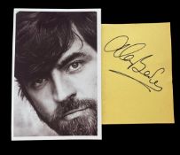 Alan Bates signature dated 1986 with black and white photo. Photo measures 4x6" appx. Good