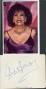 Shirley Bassey signed album page with unsigned 6x4inch colour photo. Good condition. All