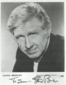Lloyd Bridges signed black and white photo. Dedicated. Measures 8"10"appx. Good condition. All