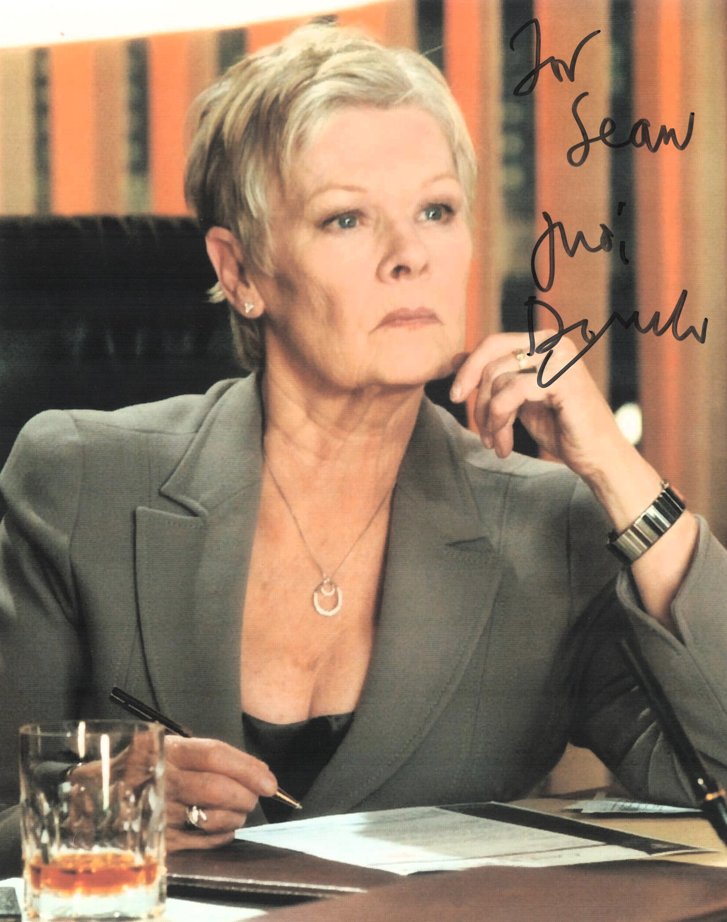 Judi Dench signed colour photo from her role as M in James Bond. Measures 8"x10" appx. Good