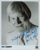 Ray Conniff signed 10x8 inch black and white promo photo dedicated. Good condition. All autographs