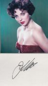 Joan Collins DBE signed Autograph post card 5.5x3.5 Inch includes colour photo Approx. 6.25x5