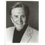 Kirk Douglas signed 10x8 inch black and white vintage photo. Good Condition. All autographs come