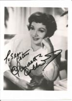 Claudette Colbert signed 7x5 inch black and white photo dedicated. Good Condition. All autographs