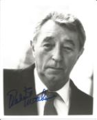 Robert Mitchum signed 10x8 inch black and white photo. Good Condition. All autographs come with a