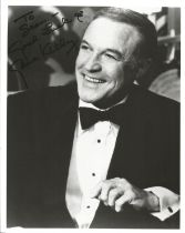 Gene Kelly signed 10x8 inch black and white photo dedicated. Good Condition. All autographs come