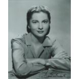 Joan Fontaine signed 10x8 inch black and white photo dedicated. Good Condition. All autographs