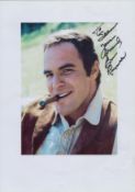 Bert Reynolds signed 12x8 inch colour photo page dedicated. Good Condition. All autographs come with