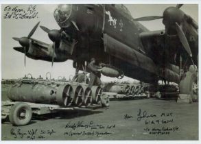 A Lancaster on the ground being loaded with Bombs, Black and White Photo, Signed by 5 including