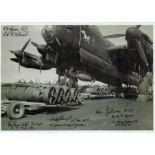 A Lancaster on the ground being loaded with Bombs, Black and White Photo, Signed by 5 including