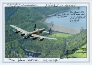 A close-up of a Lancaster in Flight pictured from alongside in front flying over a Dam, Colour Photo