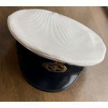 Officers and Senior Rating Class 1 cap, white with black rim and peak, Badge is an anchor with
