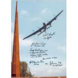 A Lancaster Flying Over the Spire Memorial, Colour Photo Signed by 7 including H J Flowers, E A