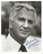 Leslie Nielsen signed 10x8 inch vintage black and white photo. Good condition. All autographs come