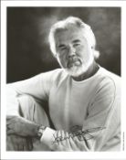 Kenny Rogers signed 10x8 inch black and white photo. Good condition. All autographs come with a