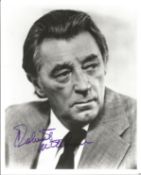 Robert Mitchum signed 10x8 inch black and white photo. Good condition. All autographs come with a