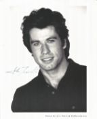 John Travolta signed 10x8 inch black and white photo. Good condition. All autographs come with a