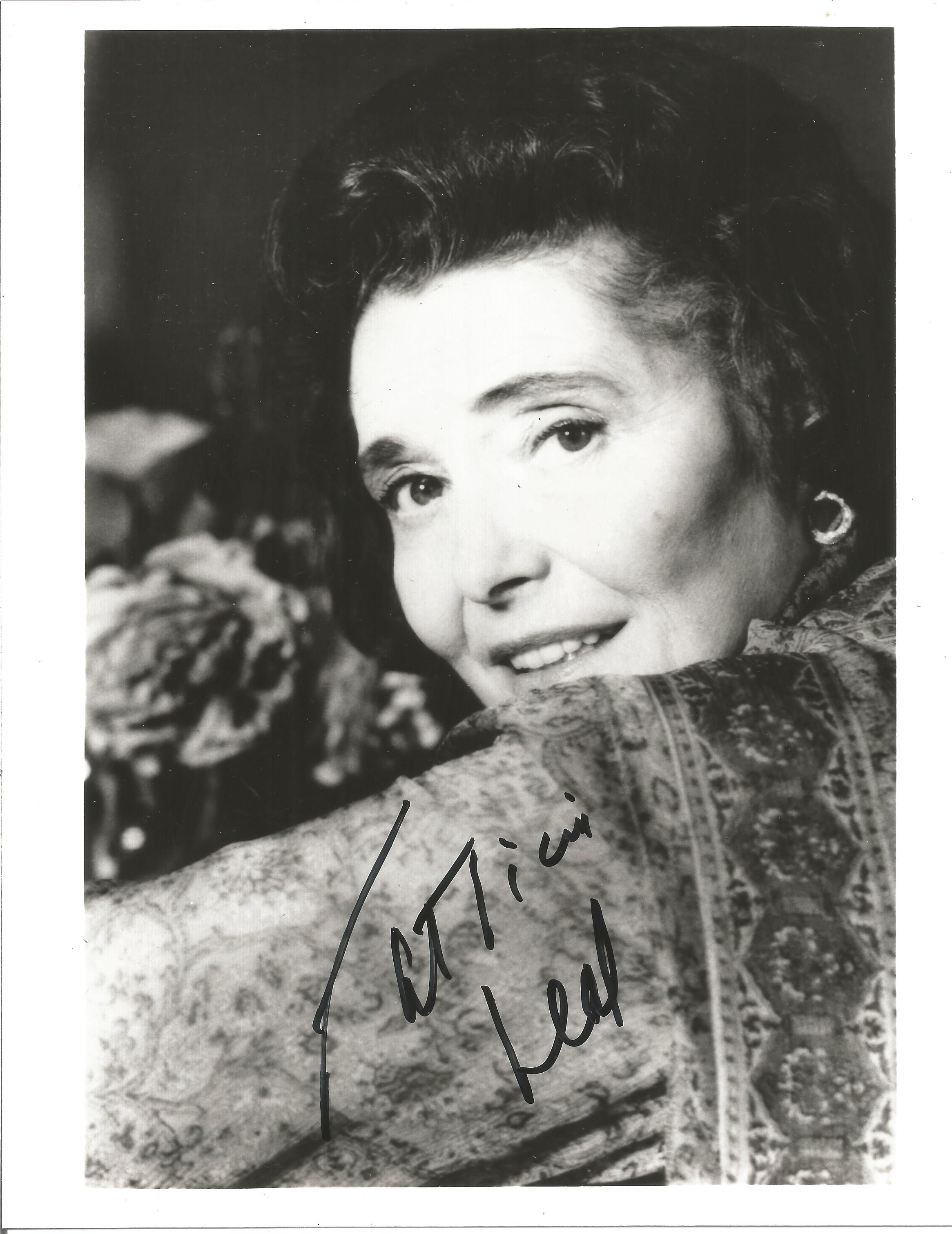 Patricia Neal signed 10x8 inch black and white photo. Good condition. All autographs come with a