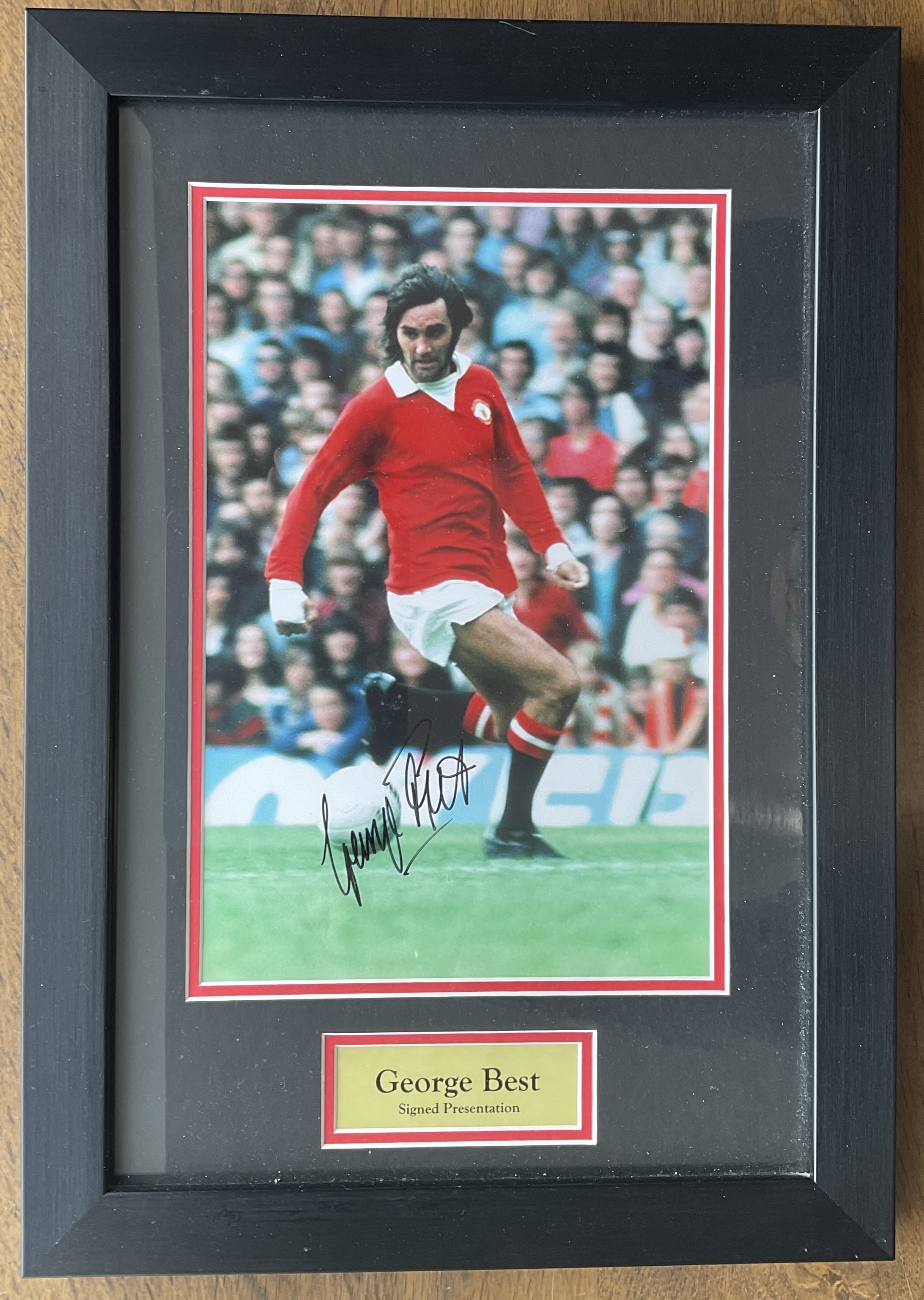 George Best signed 13x18 colour photo in frame. Good condition. All autographs come with a