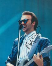 MIDGE URE signed Band Aid 8x12 Photo. Good Condition. All autographs come with a Certificate of